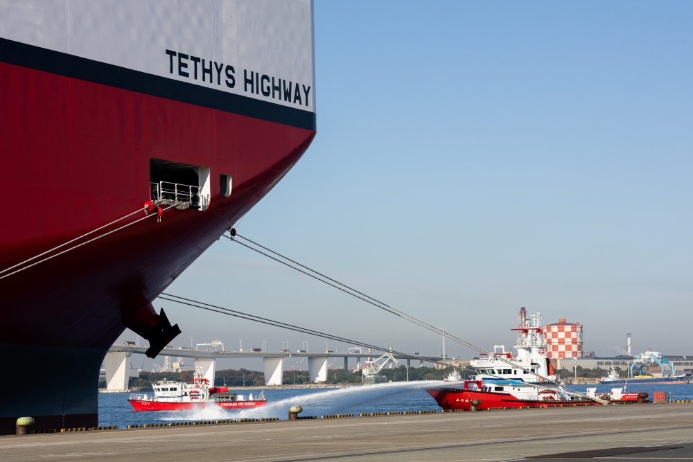 The drill, spraying water from fire boats