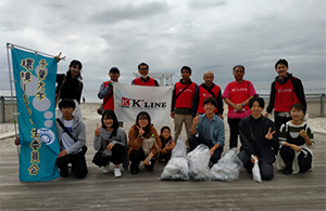Group photo at beach cleanup activity