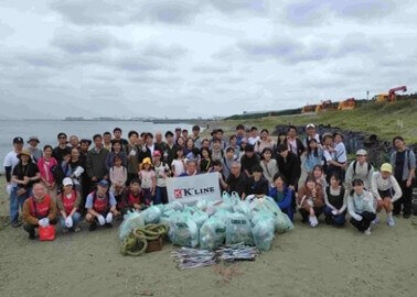 Group photo at beach cleanup activity