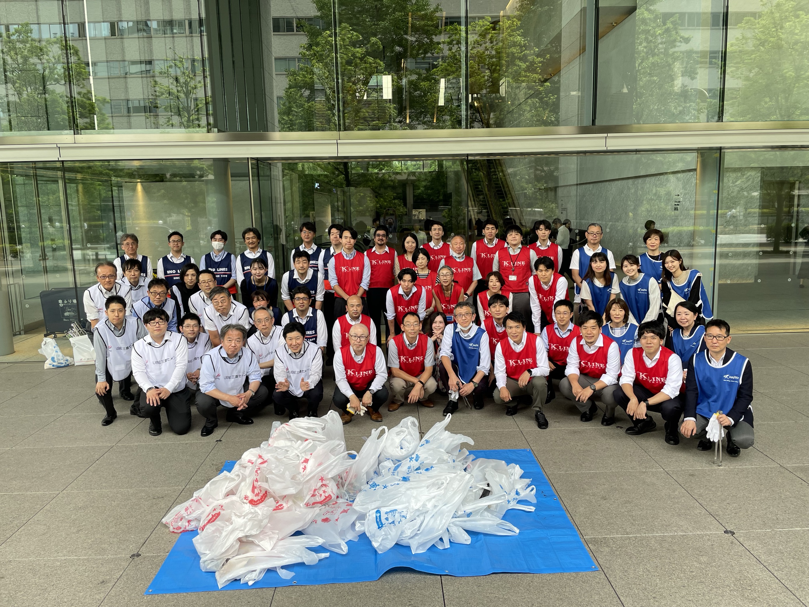 Participants of cleaning-up actvities and the gathered trash.